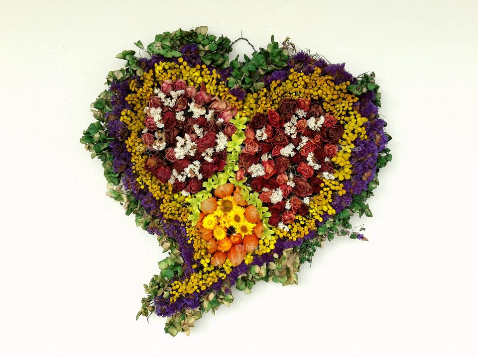 heart made of flowers and green. floristic work