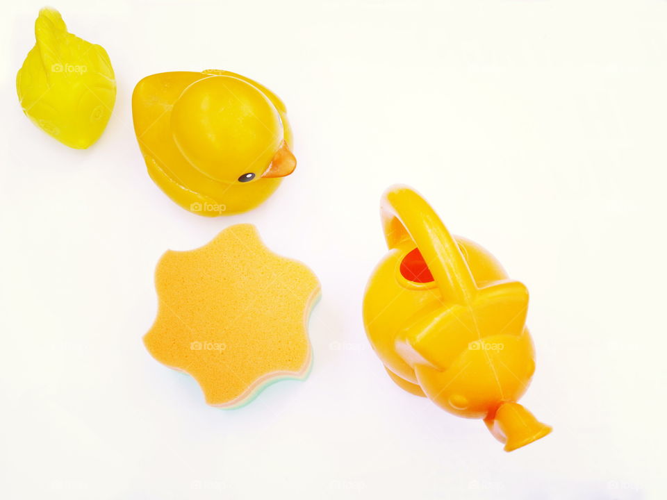 Go yellow. Yellow bath accessories on white background