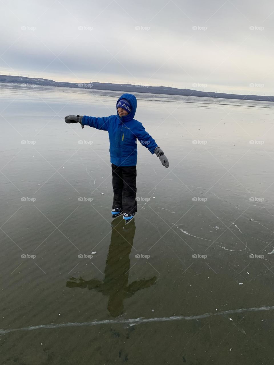 Shadow on the clear lake of ice