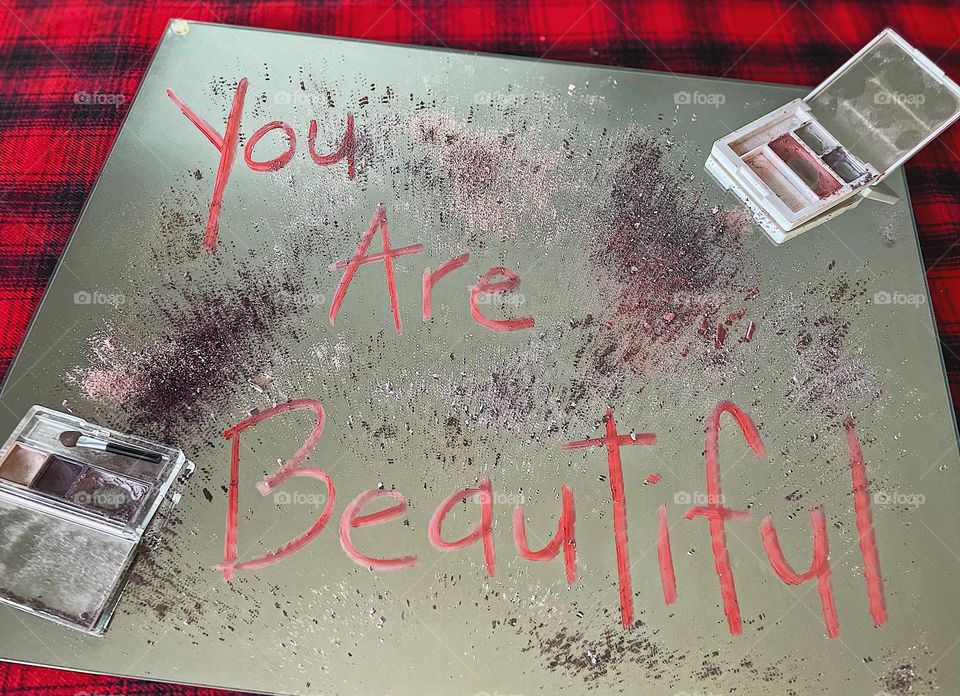 Message written on the mirror, writing on a mirror with lipstick, messages of positivity for women, makeup brands take a stand, Clinique eye shadow product placement, destroying makeup, making a mess with makeup, message written with lipstick 