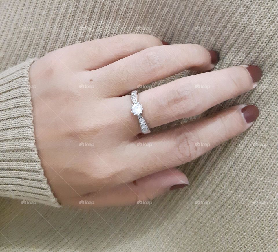 Luxury white gold ring against on cream background