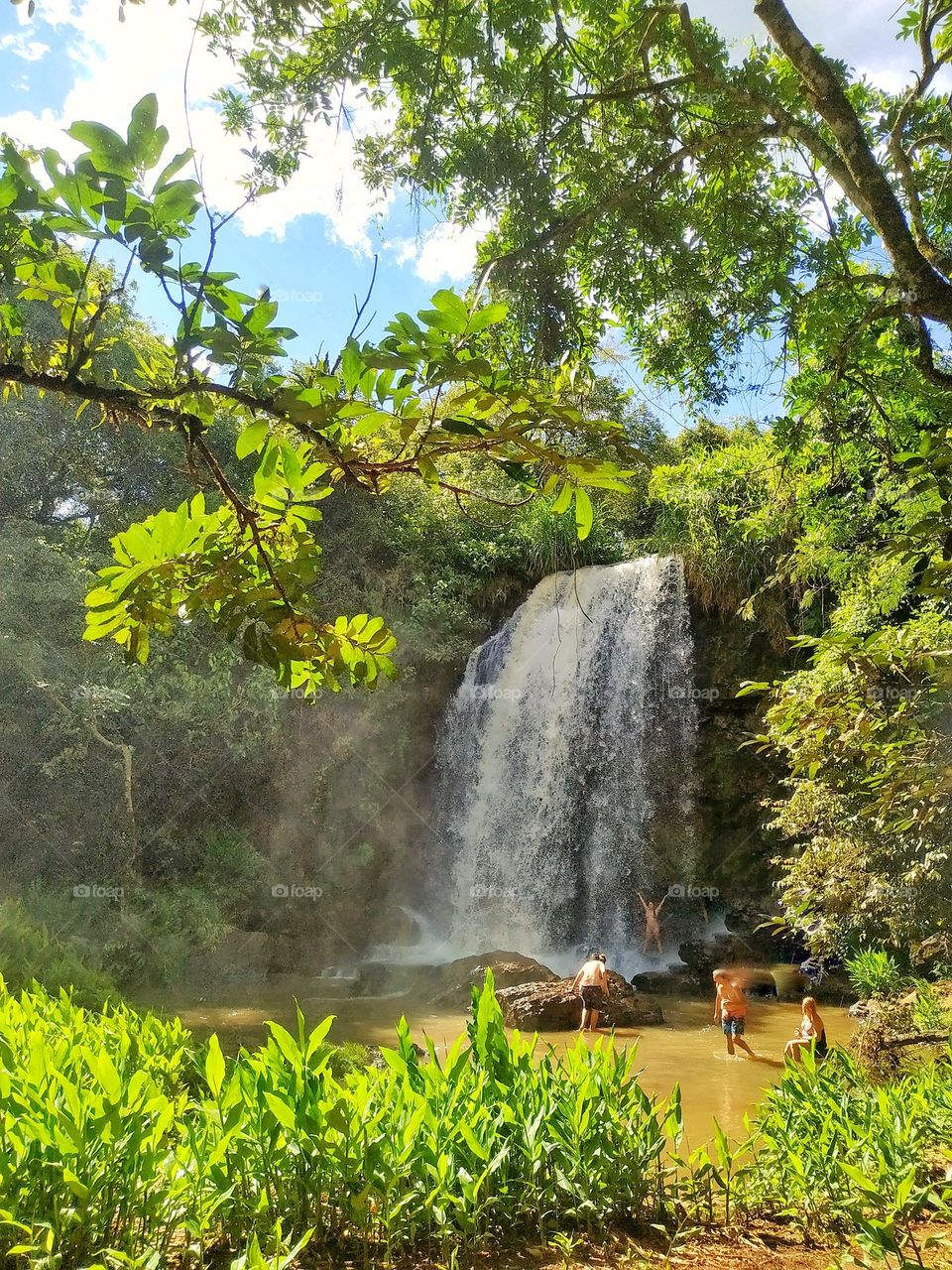 Bathing in a waterfall on a hot summer day is refreshing and fun, as well as therapeuthic...