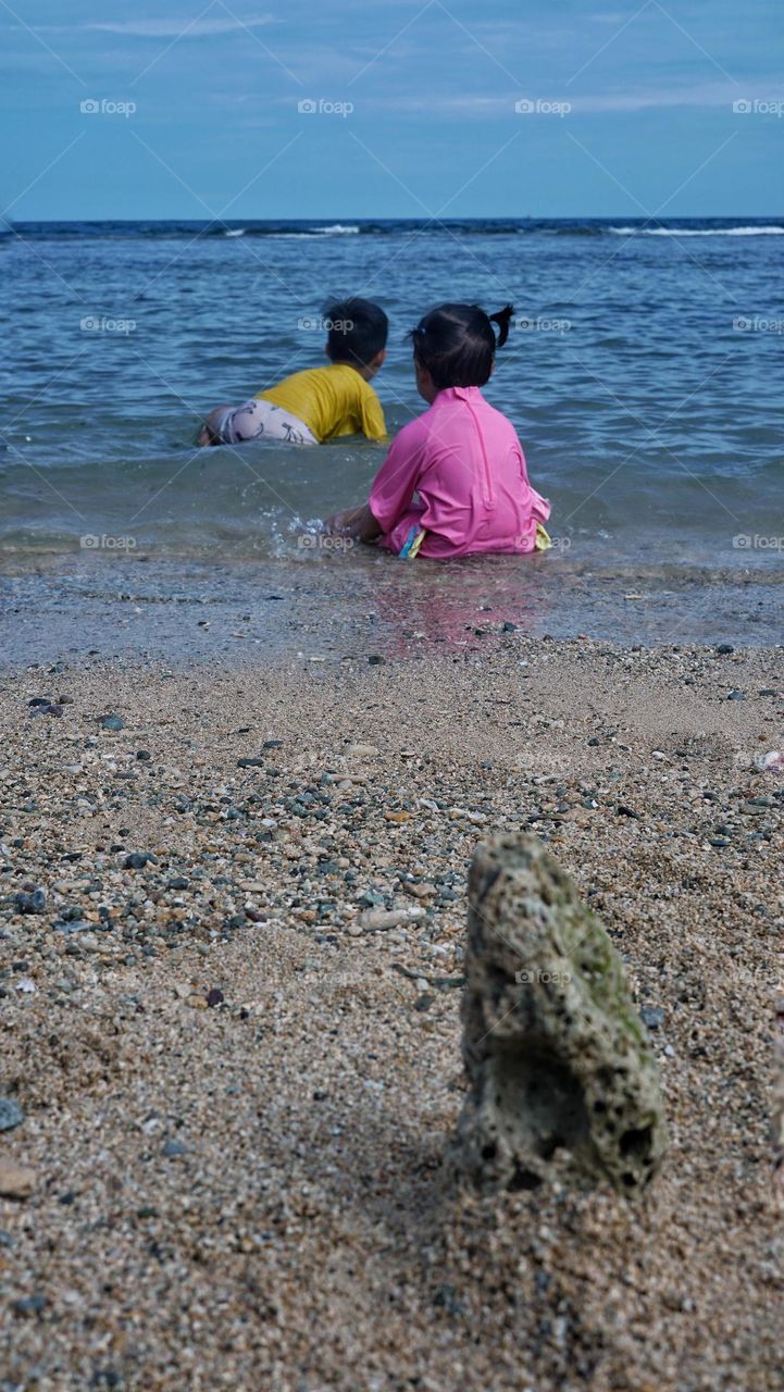 children are most happy when playing on the beach