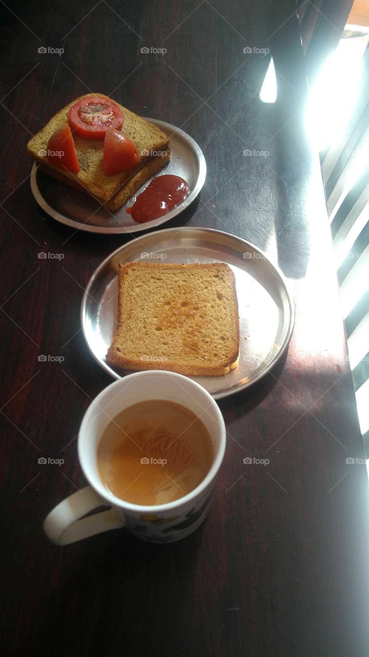 Tea toast and a tomato cheese sandwich in morning. Enjoy your meal with me. It boosts my day. What about yours?
