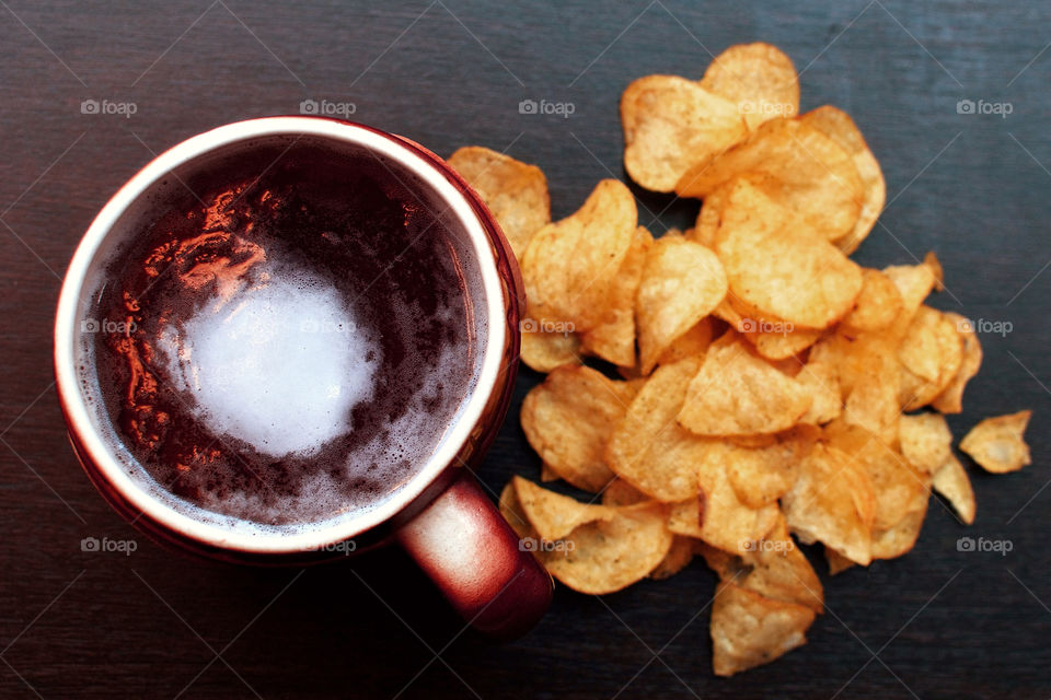 Glass of beer and chips