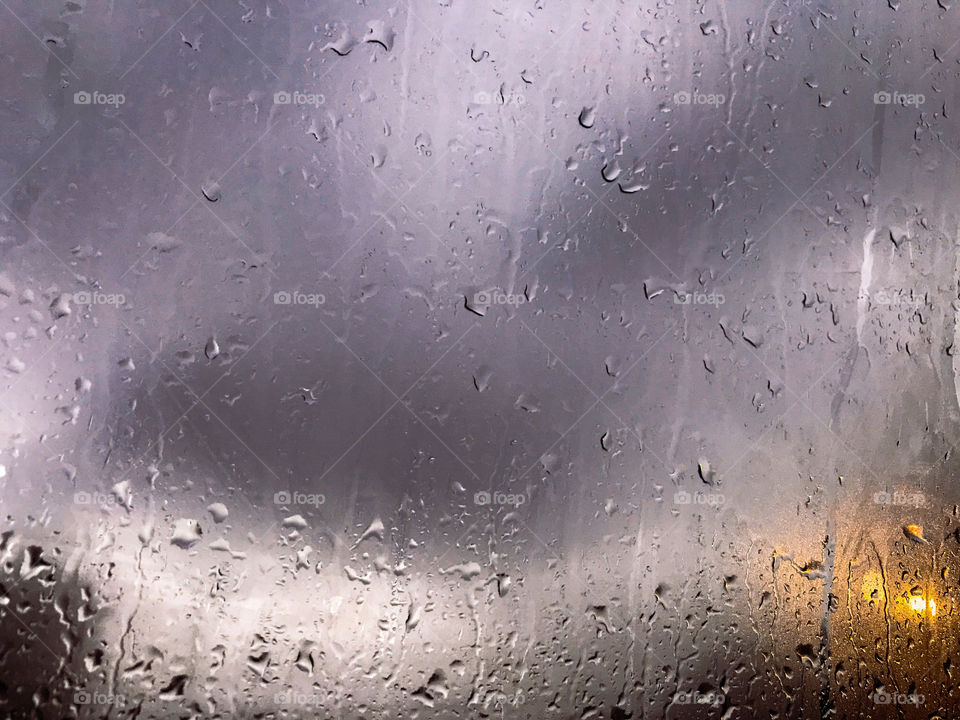 Raindrops on glass window 