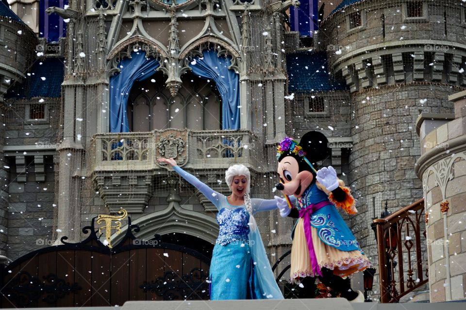Beautiful woman with Mickey mouse during winter