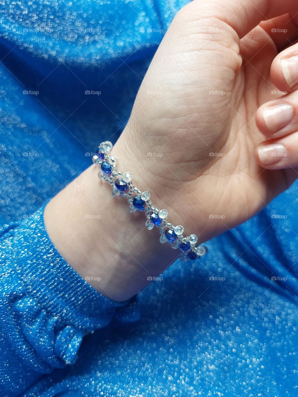 handmade bracelet with blue sparkly stones.
