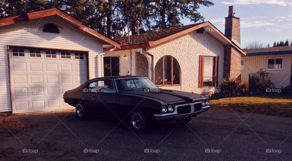 Muscle Car Parked in the Driveway 