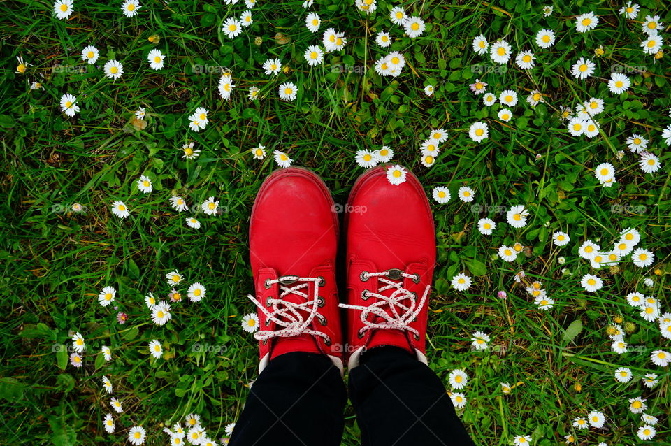 Red boots among pretty little flowers