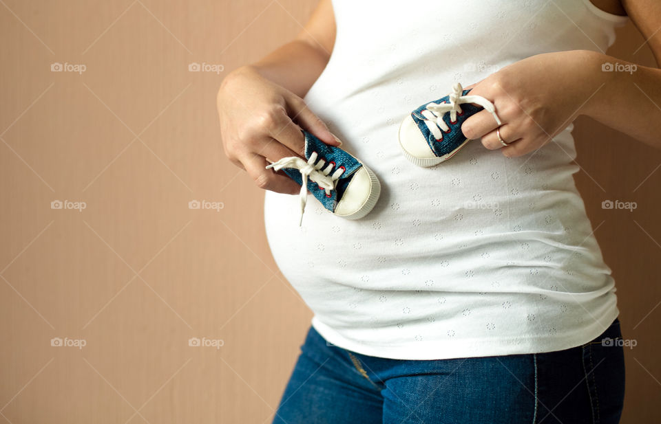 Pregnant women with small baby booties