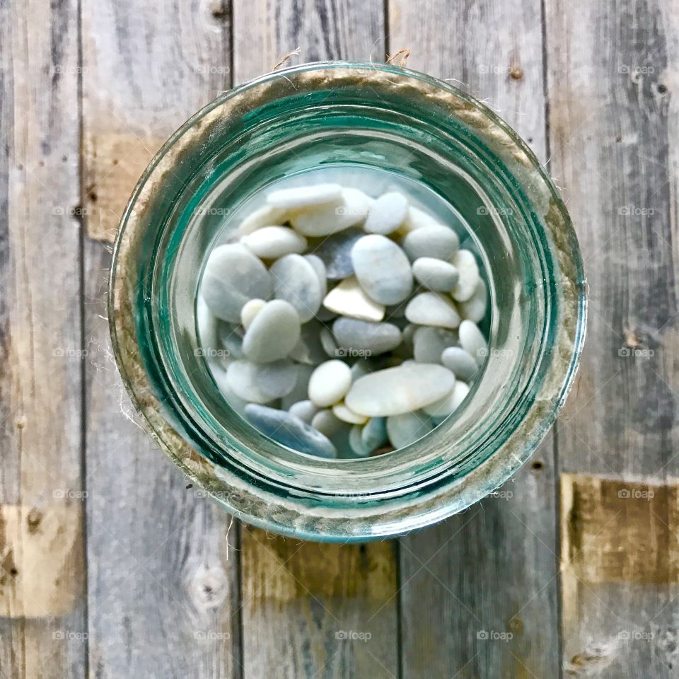 High angle view of pebbles in jar
