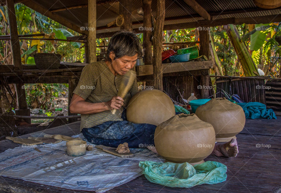 This lady has been making homemade clay pots for decades without the use of a wheel 
