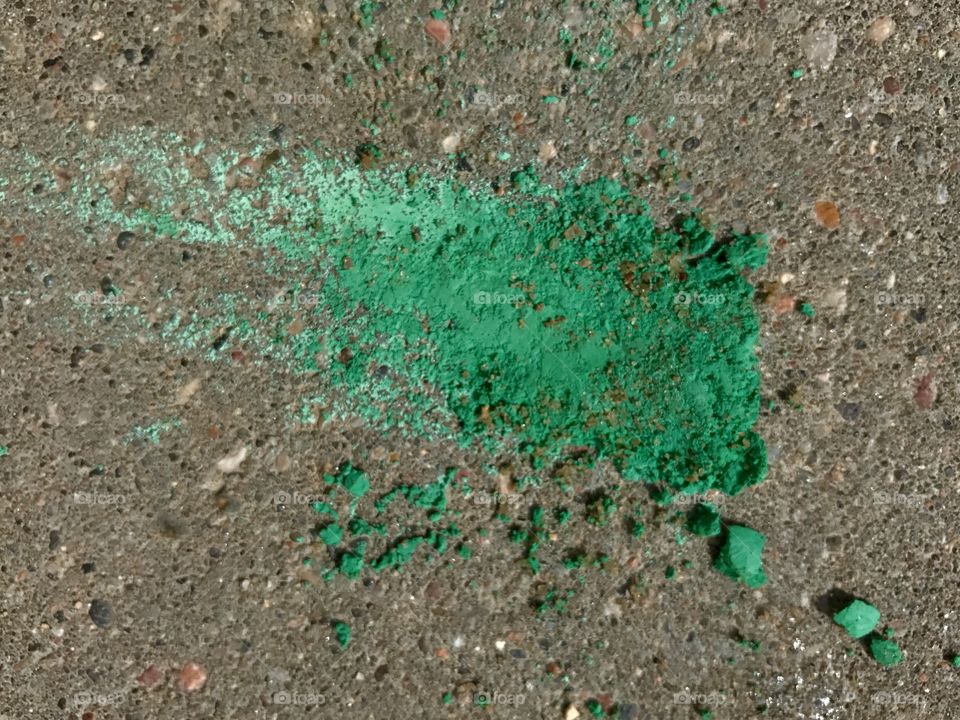 Green paint on asphalt 