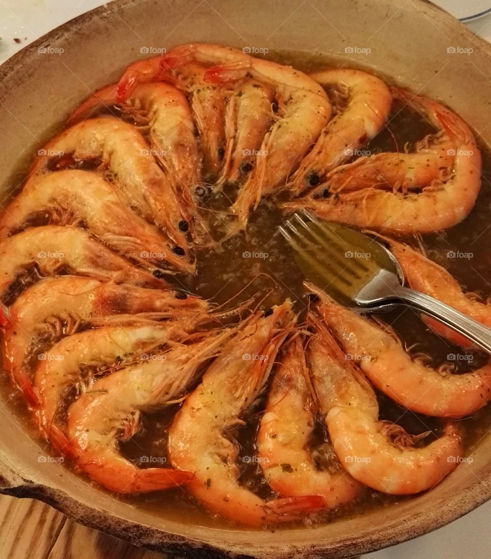 langoustine ordered in a mud  cooking pot