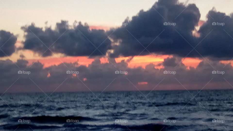 Sun waking up the sky on a South Florida Beach
