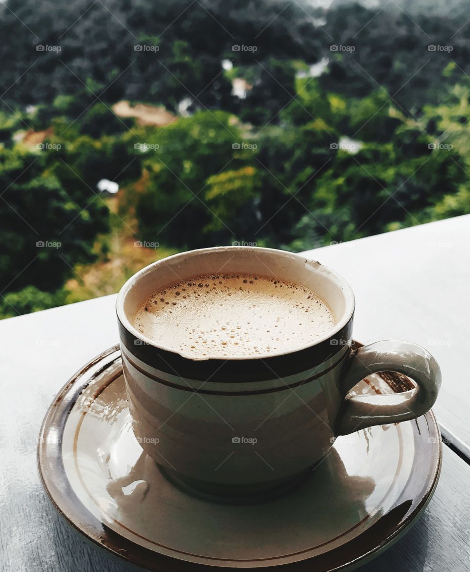 a cup of coffee on the mountain