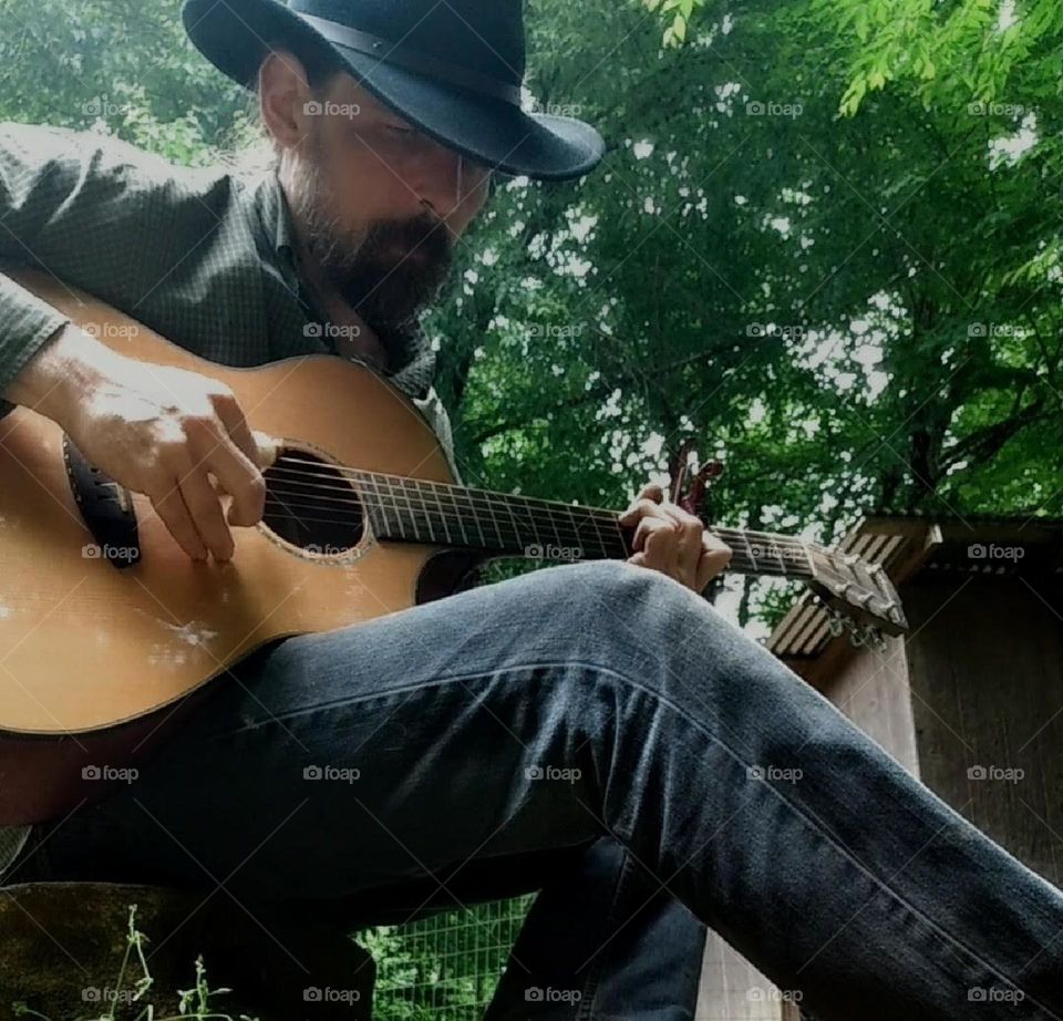 Playing guitar outside