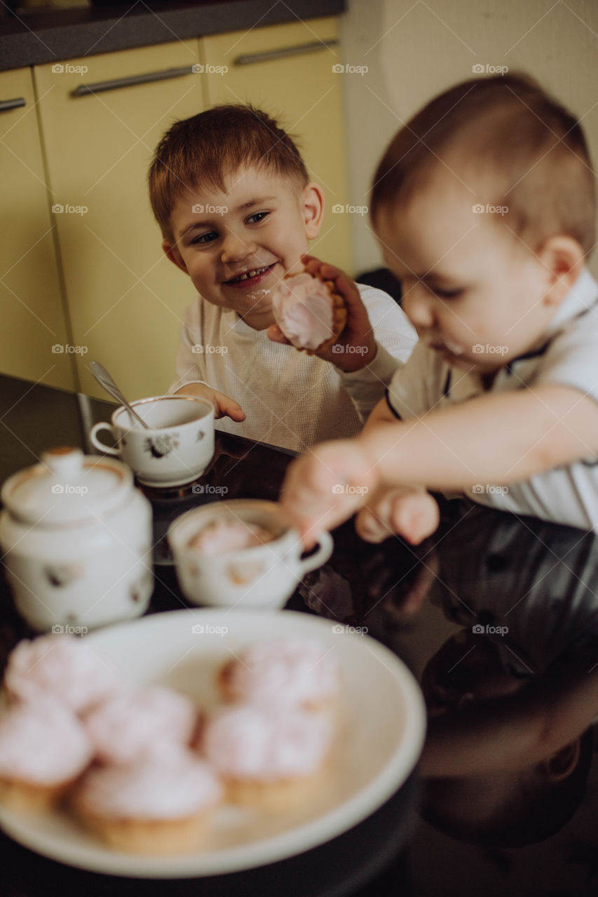 boys drink tea at home