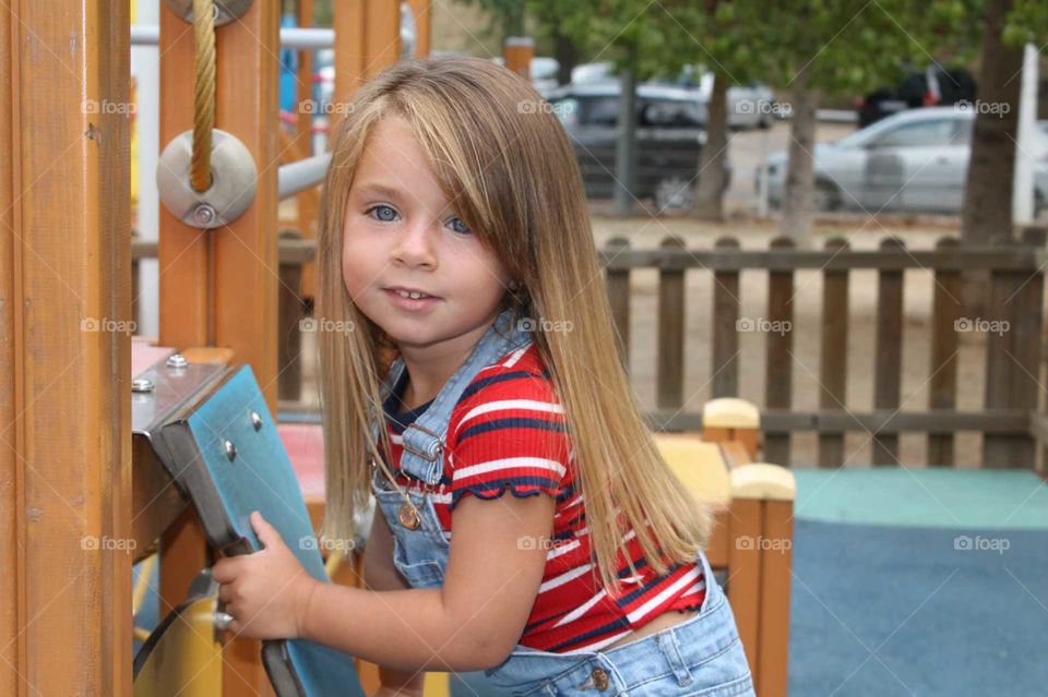 blond girl in a playground