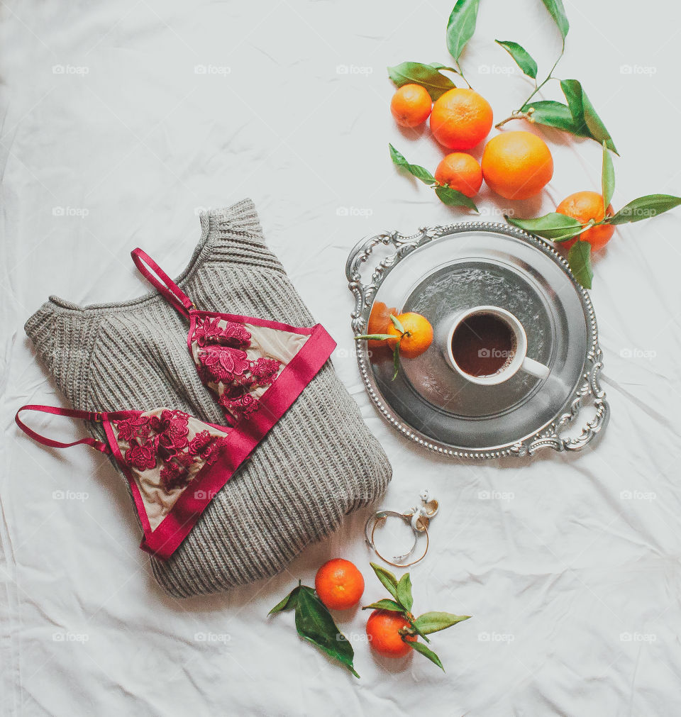 Tea with oranges and female clothes
