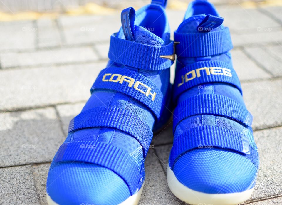 Custom made basketball coach shoes for a High School Basketball team. Blue and Gold Colors