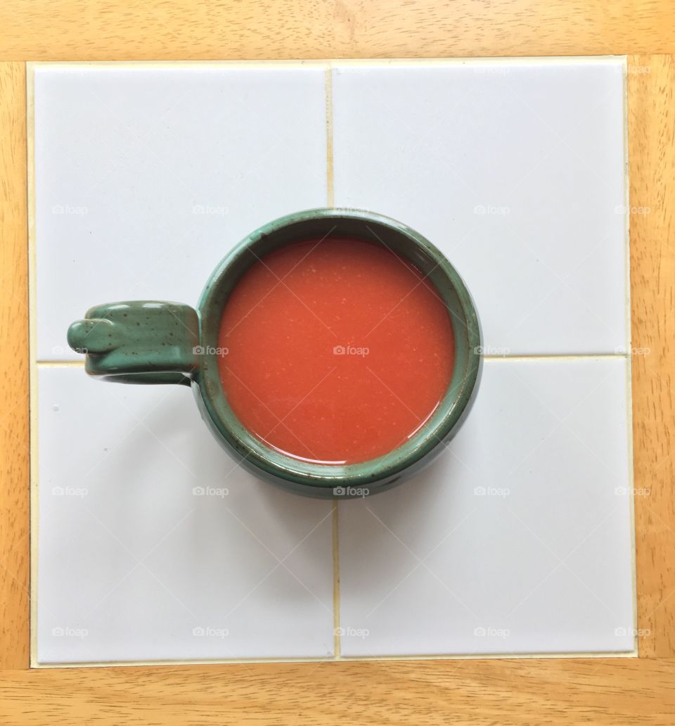 Homemade tomato soup in a homemade ceramic bowl