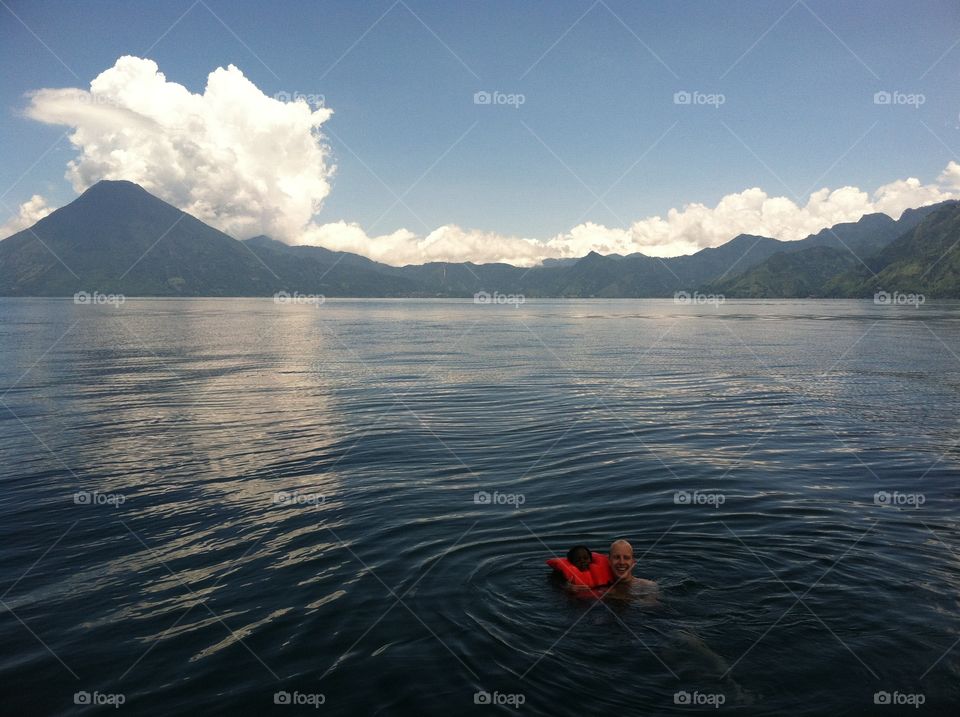 Lake Atitlan. Father and daughter swimming in Lake Atitlan in Guatemala