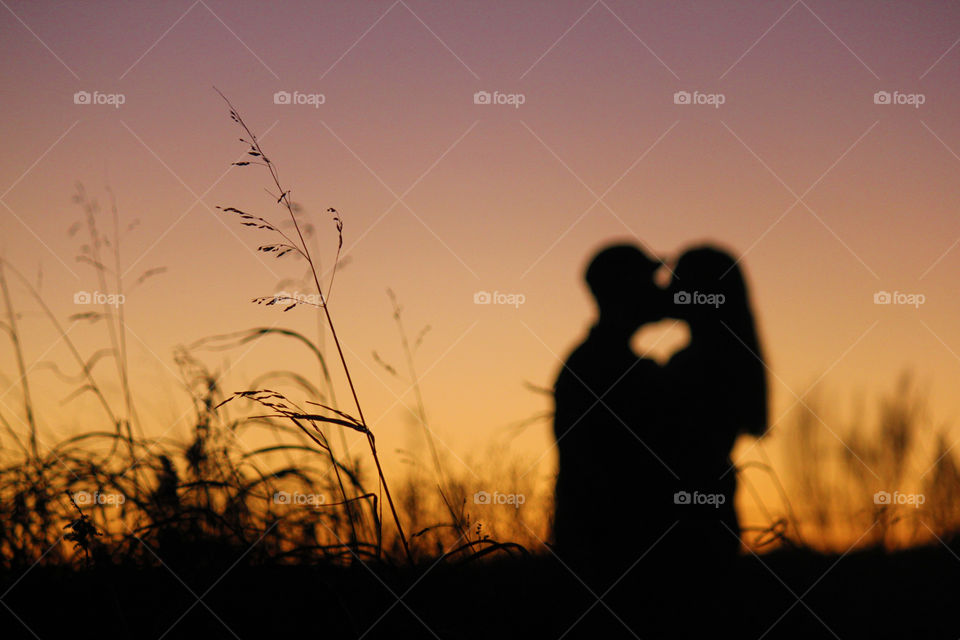 Silhouette of couple at sunset