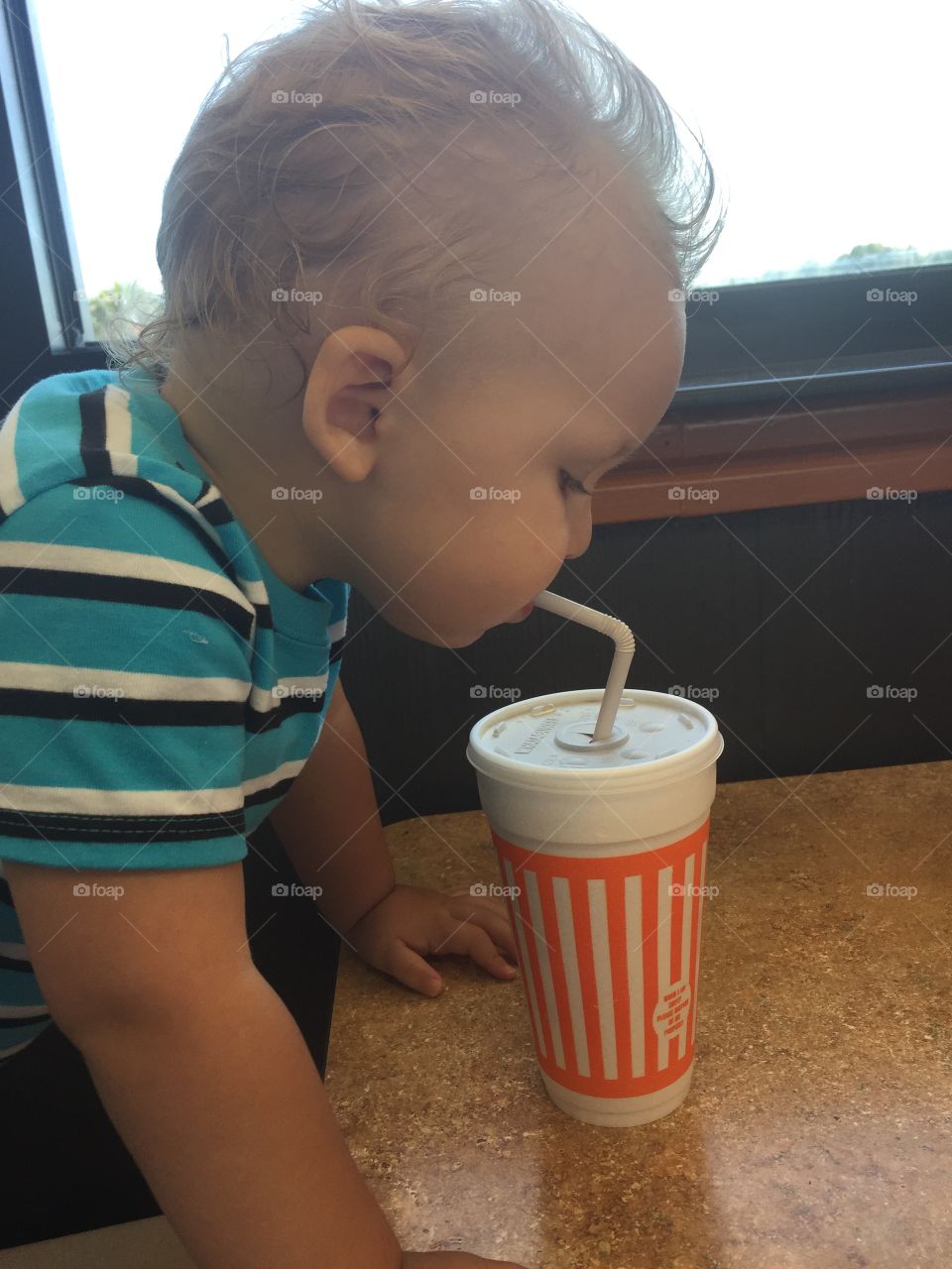Taking a drink of root beer 