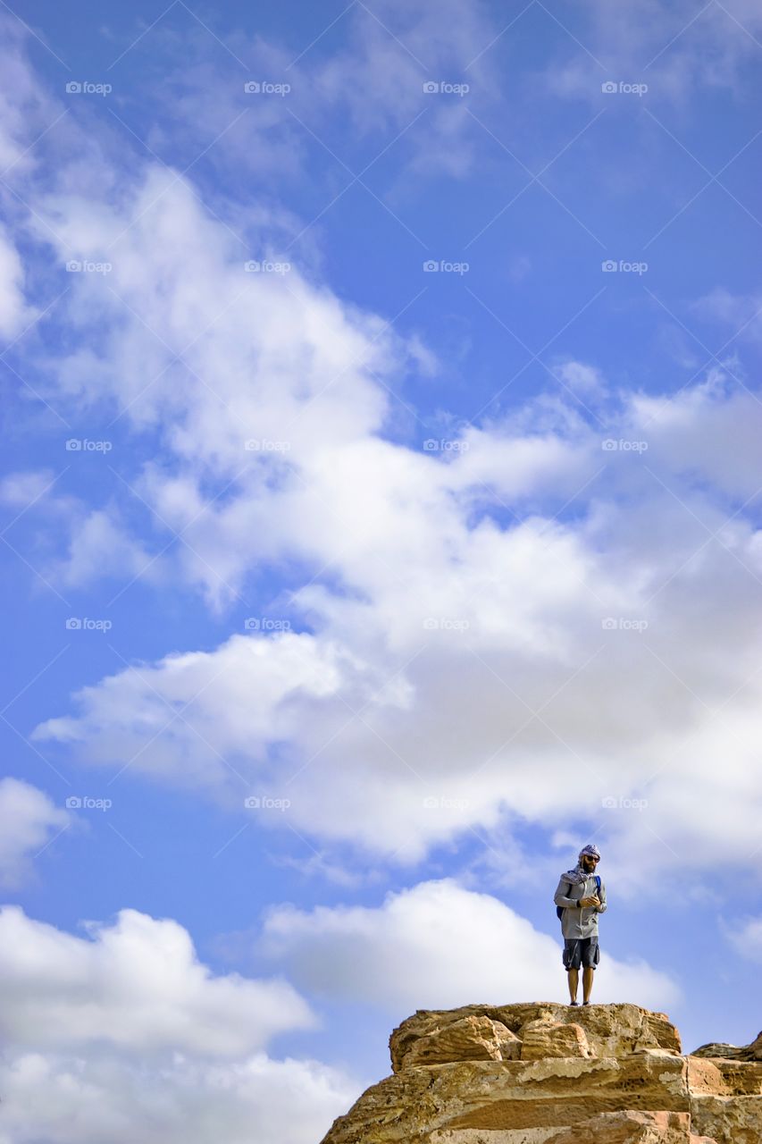 Man standing on top of the mountain