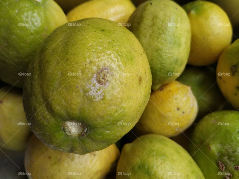 Lemon fruit color green yellow mix salty natural