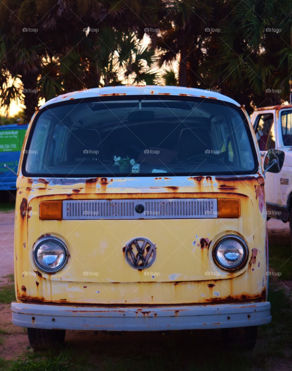 Antique Volkswagon Bus. Antique Volkswagon bus. Well used and loved I am sure !!!   A toy Volkswagon bus is on the dash.