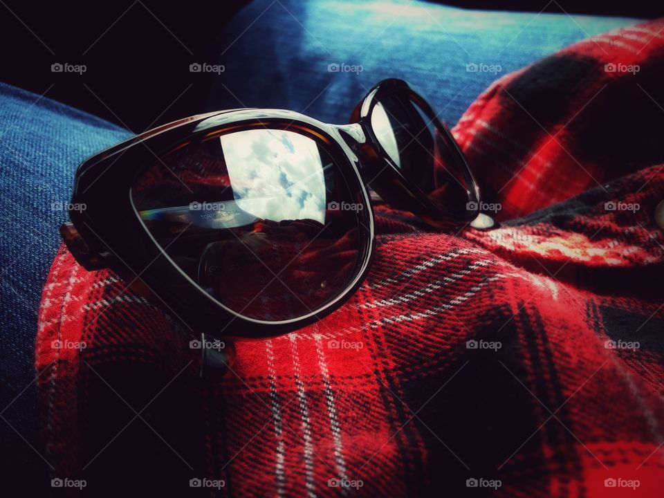 Sunglasses, Flannel Shirt and Jeans