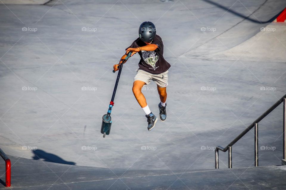 Boy and his scooter