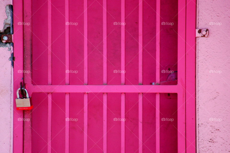 Pink metal door with lock