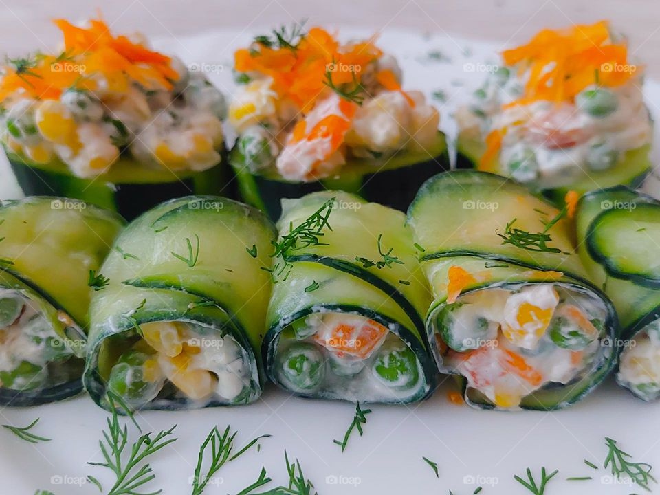 A delicious appetizer.  Fresh rolled cucumber leaves stuffed with vegetables and sour cream.  Vegetarian food