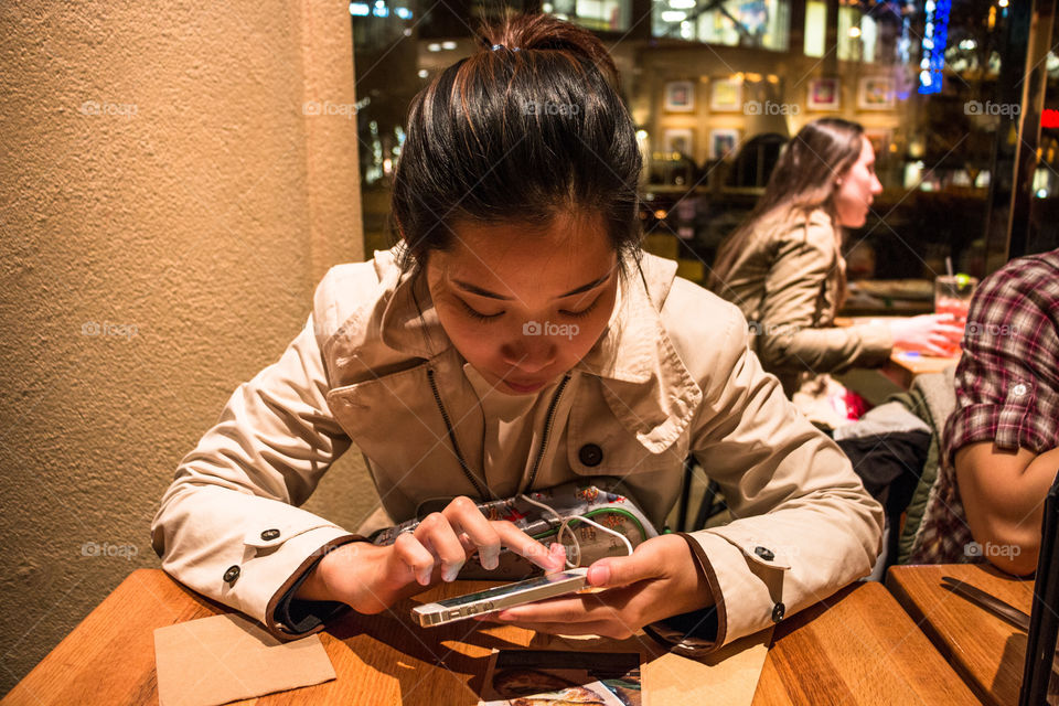 Girl playing smartphone 