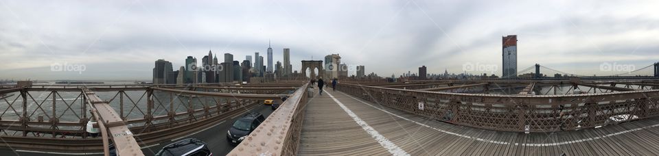 Walking across the Brooklyn Bridge toward Manhattan