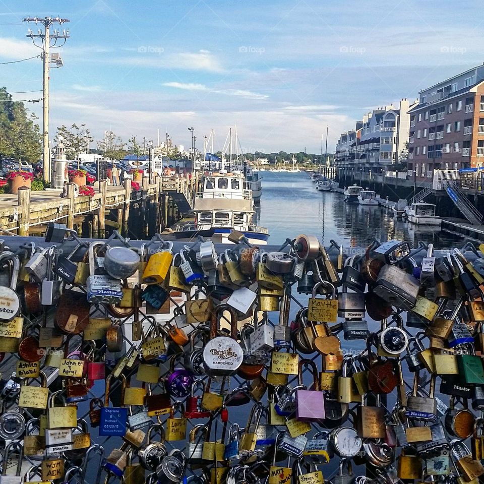 locks on a fence near a harbor