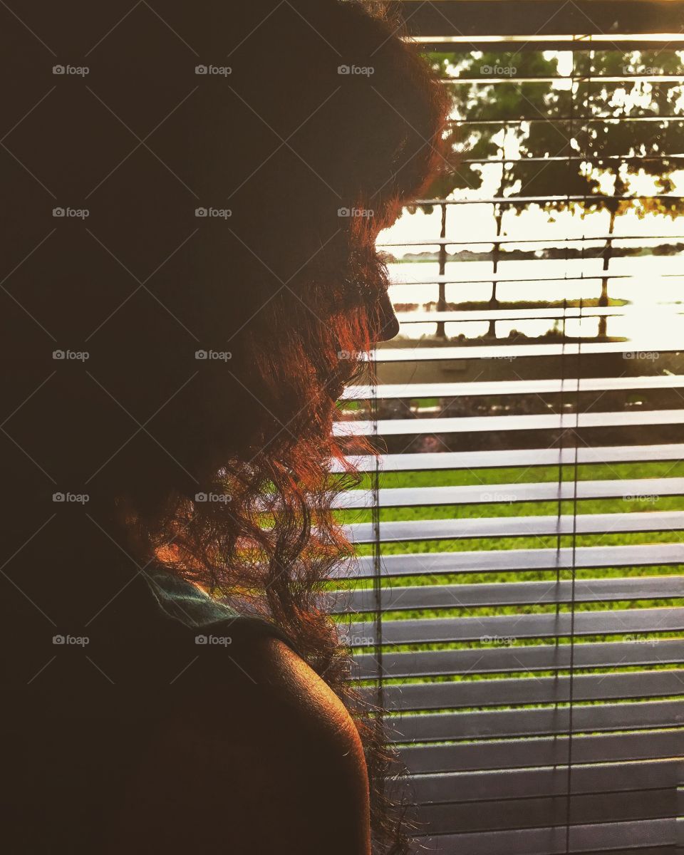 She gets up to catch the sunset peeking through the window and as it sets it greats her with a summer night kiss 