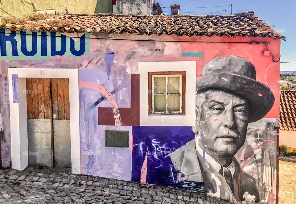 Street Art at the annual FAZUNCHAR exhibit in Figueiro dos Vinhos. This is a portrait of famed local artist José Malhoa by Draw & Contra 2020