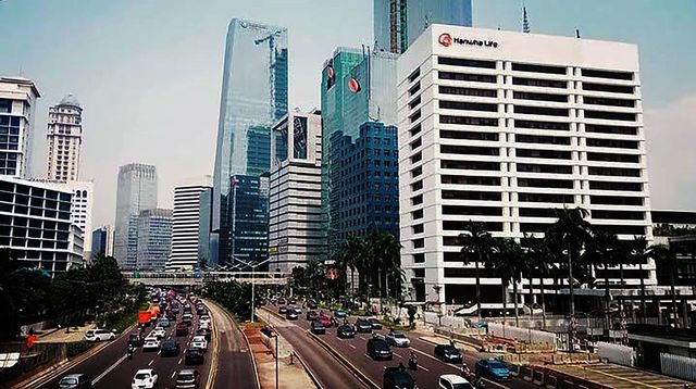 view of office buildings and road traffic in big city