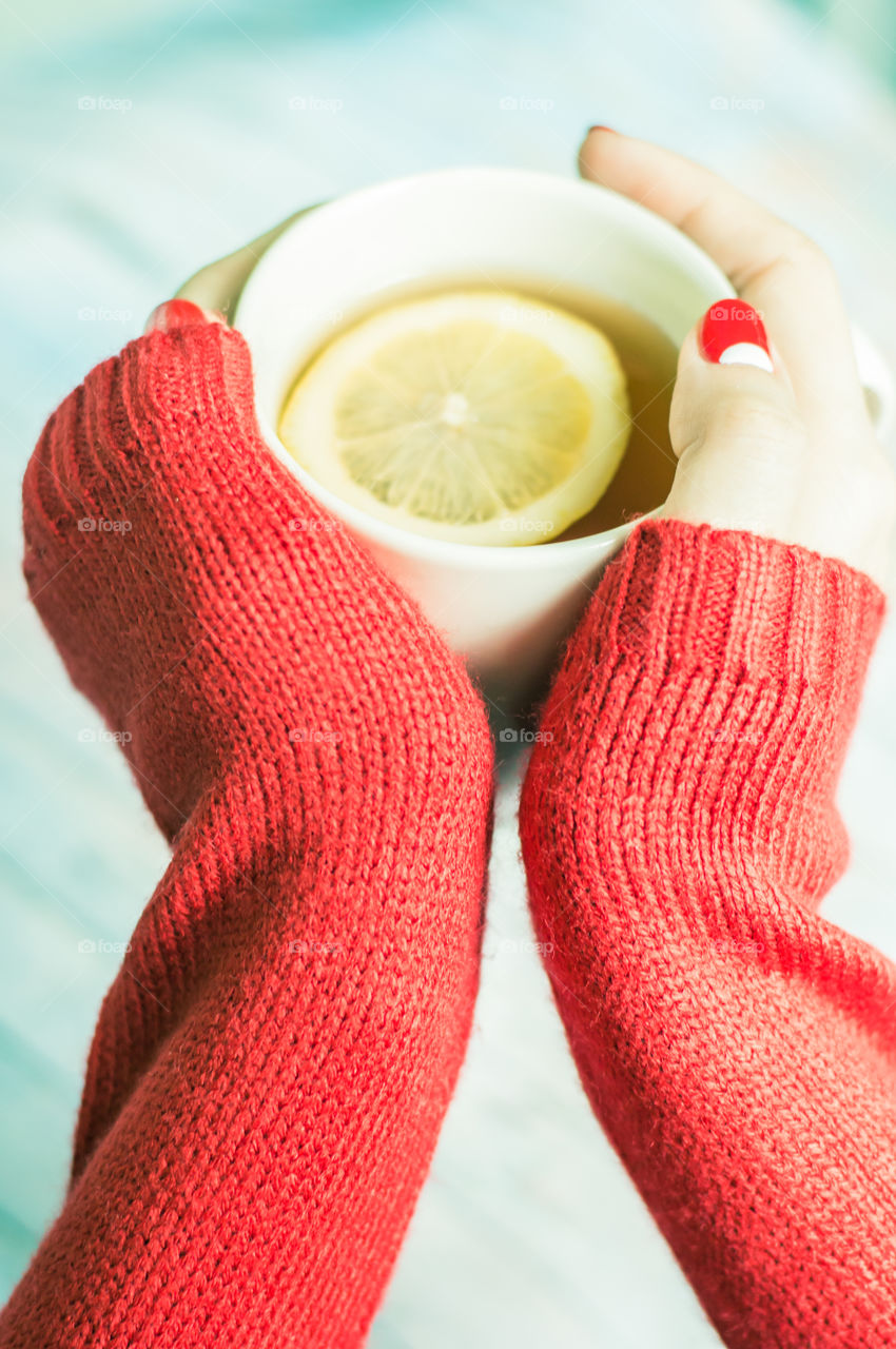 woman hand with cup of tea