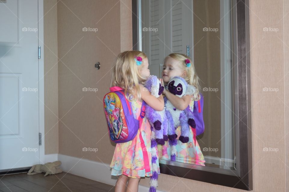 Little girl being silly in the mirror