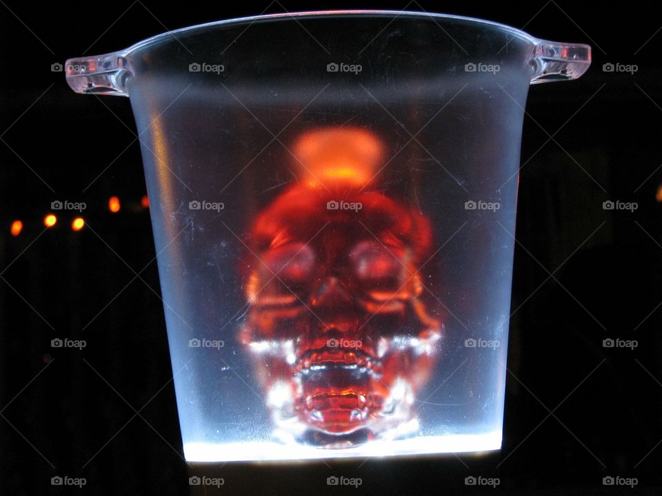 This a bottle of crystal skull that we filled with water and red food coloring with a light under it to make it visible in the dark 