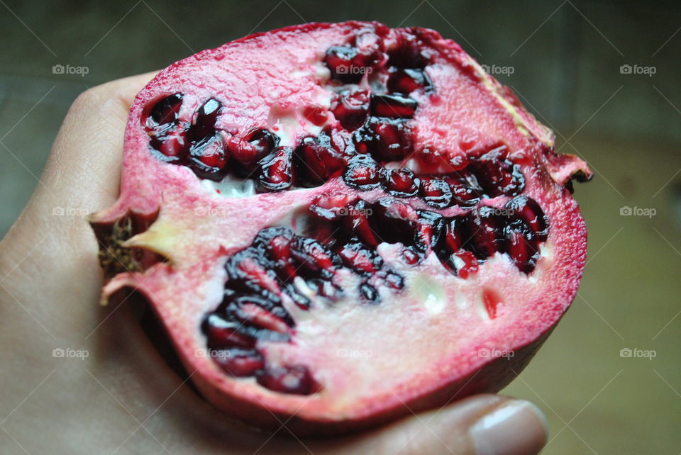 Half of a pomegranate in my hand