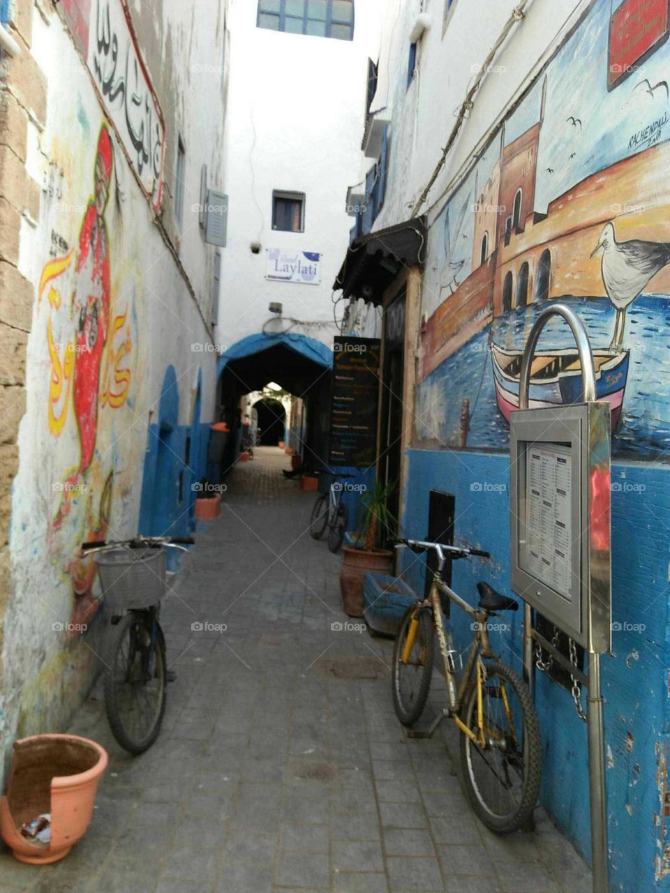 Two bicycles in ancient street at essaouira city in Morocco.