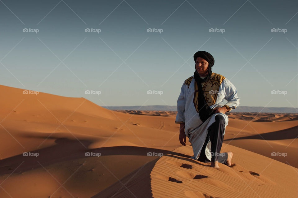 Berber Arab atop a sand dune