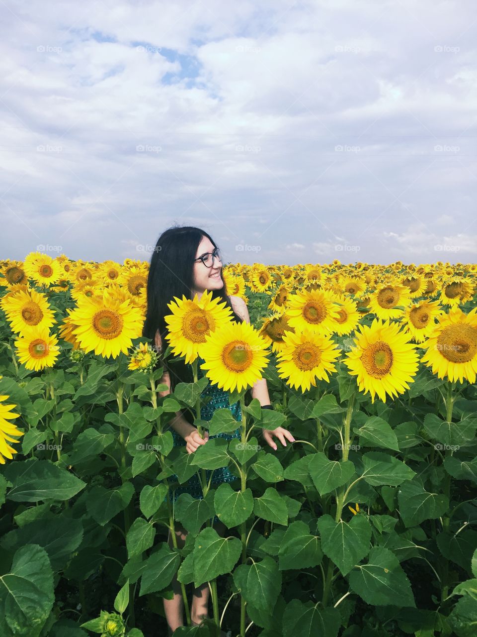 Sunny photo. Girl with sunflowers